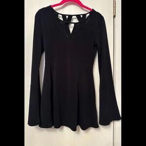 Unleash Your Inner Fashionista with this Chic Black Bell Sleeve Shirt